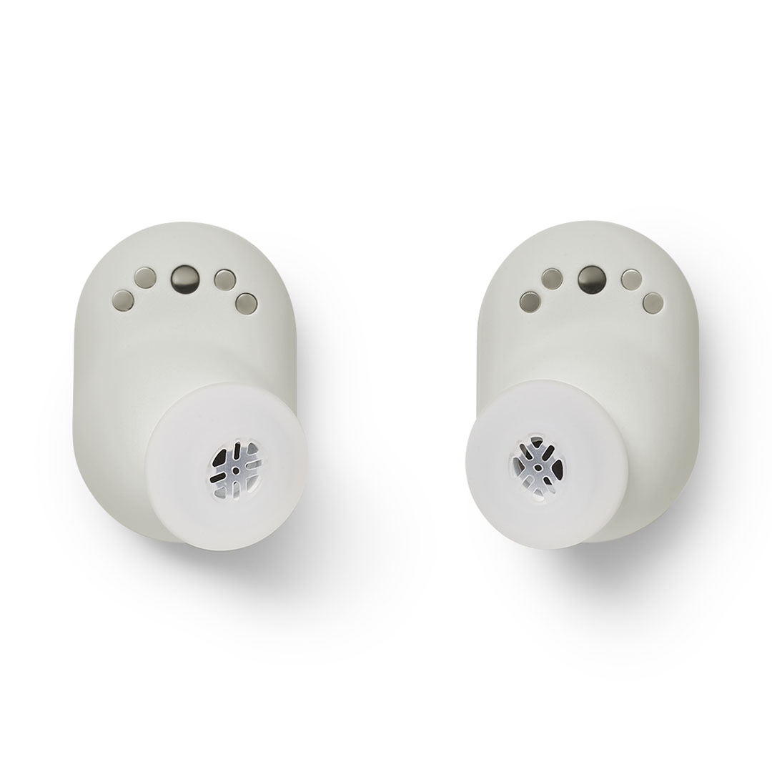 devialet-gemini-ii-light-pearl-product-image-7 Pair of white wireless earbuds with silicone ear tips