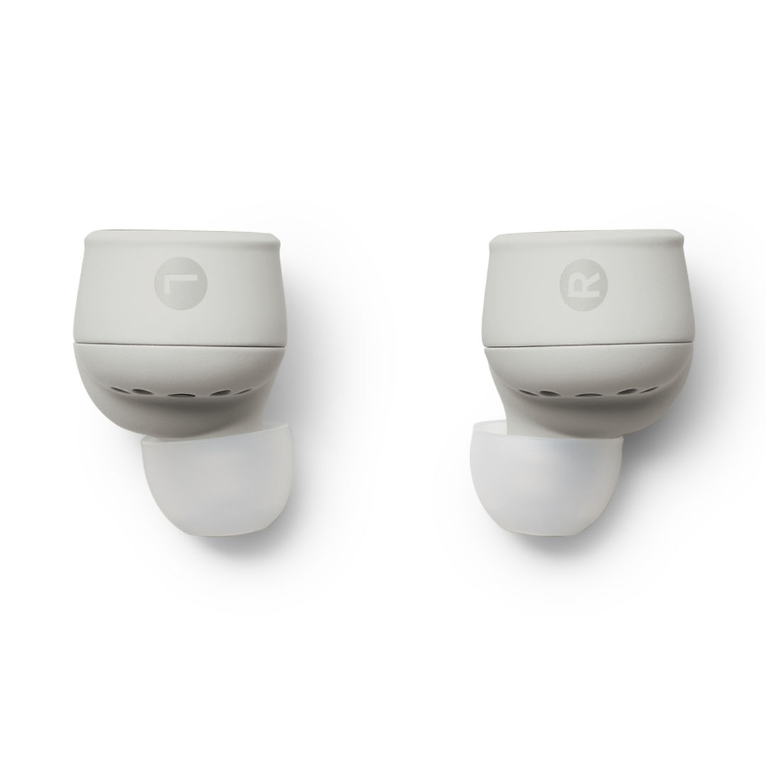 devialet-gemini-ii-light-pearl-product-image-9 Pair of white wireless earbuds with charging cases