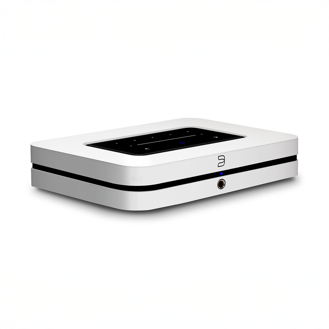 White wireless audio streaming device on white background.