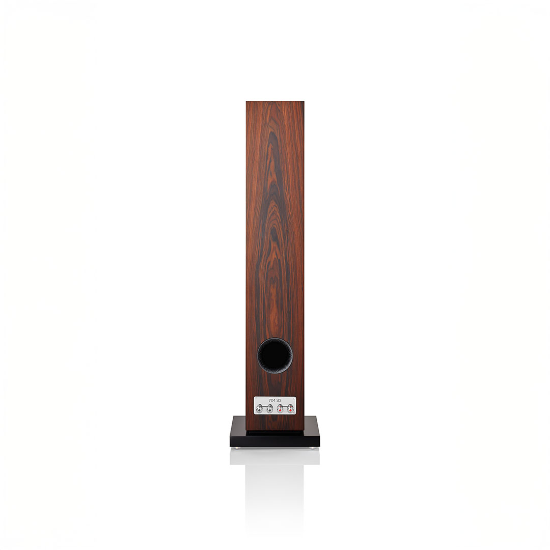 Wooden tower speaker with black base.