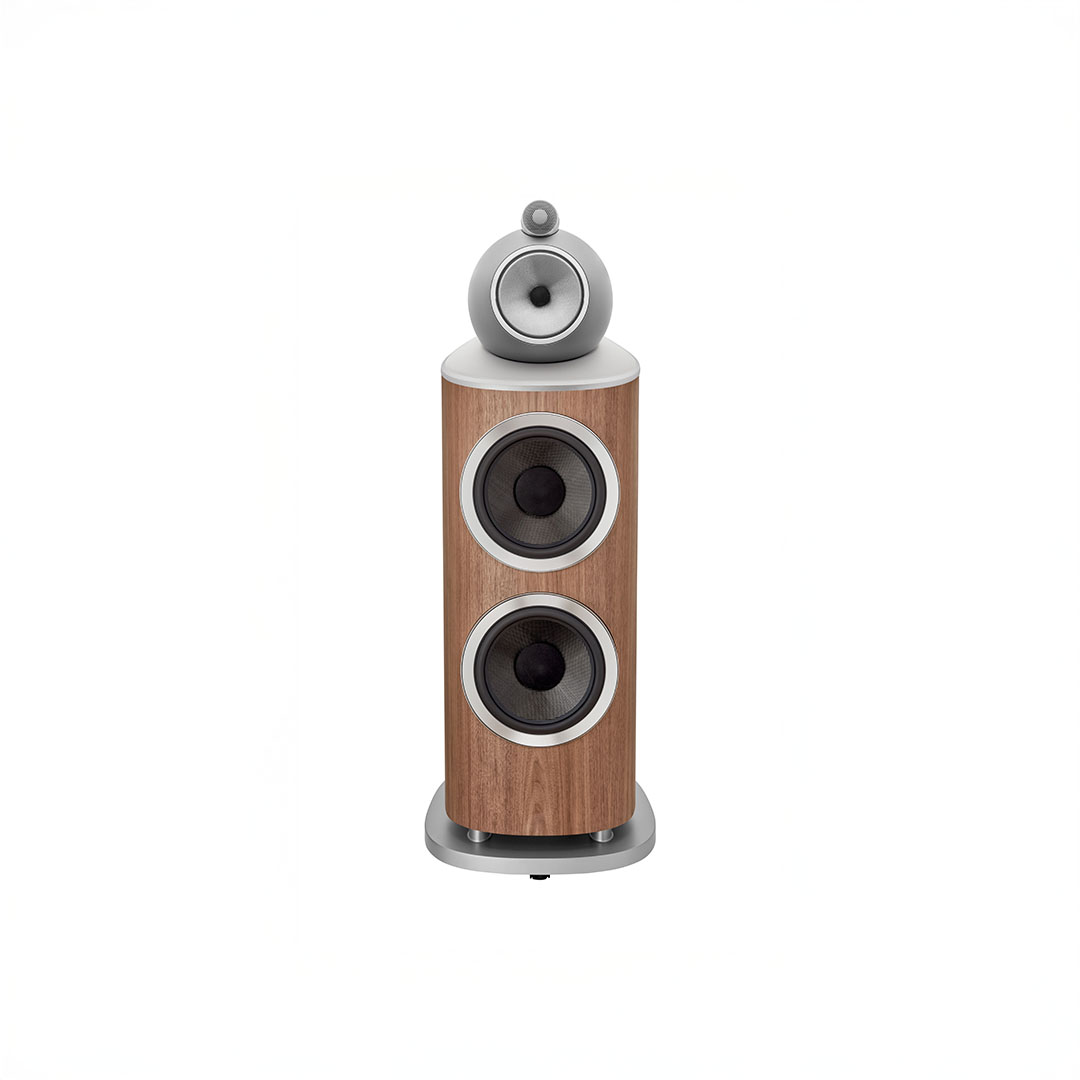 Wooden tower speaker with three circular components.
