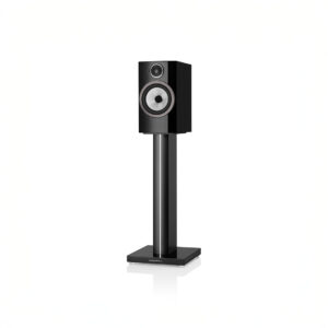 Black speaker on a tall stand.
