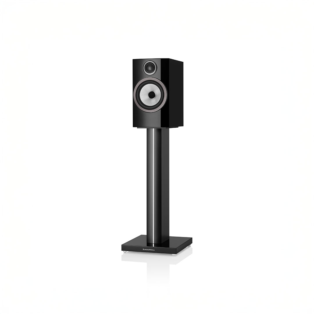 Black speaker on a tall stand.