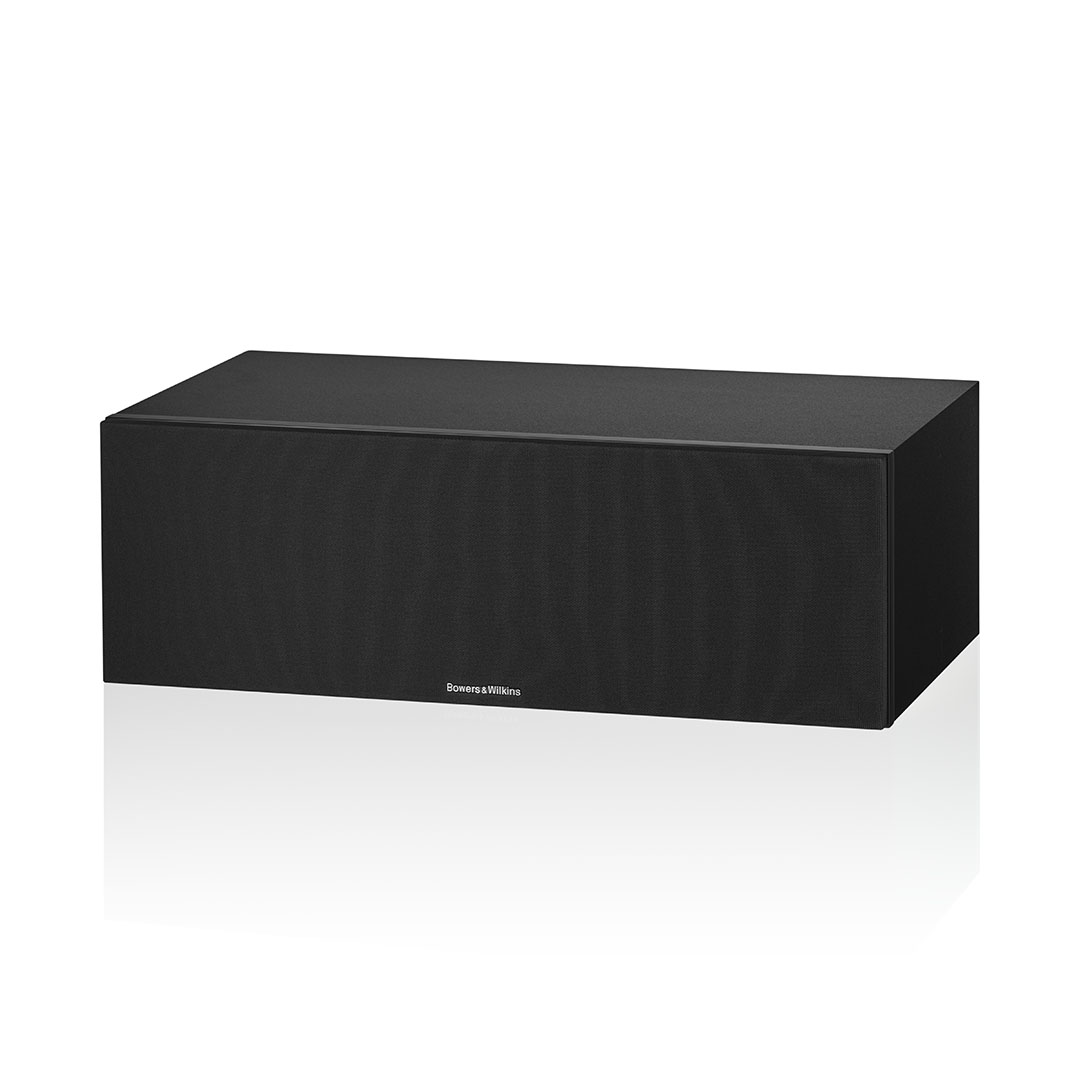 Black rectangular speaker on reflective surface.