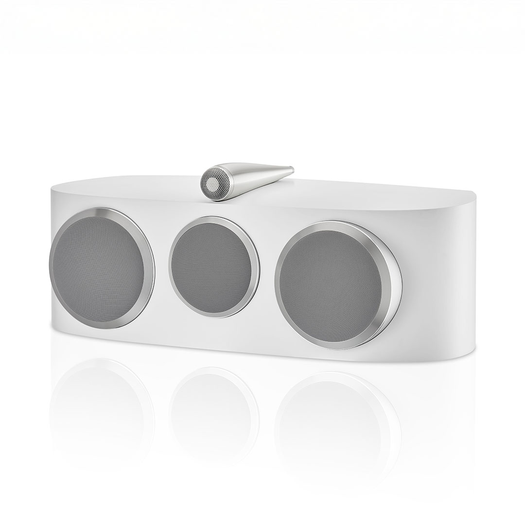White speaker with three circular drivers.
