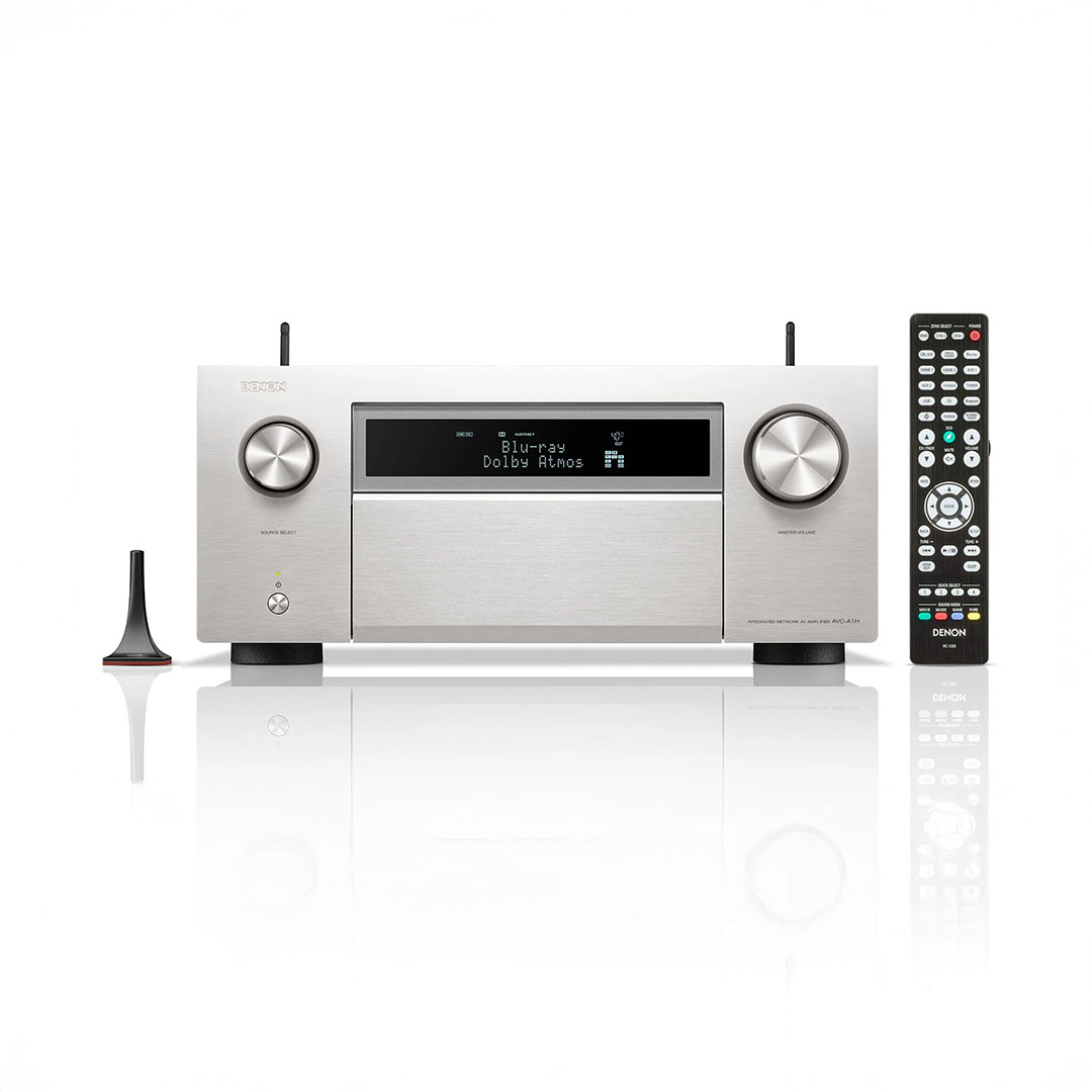 Denon audio receiver with remote control and microphone.