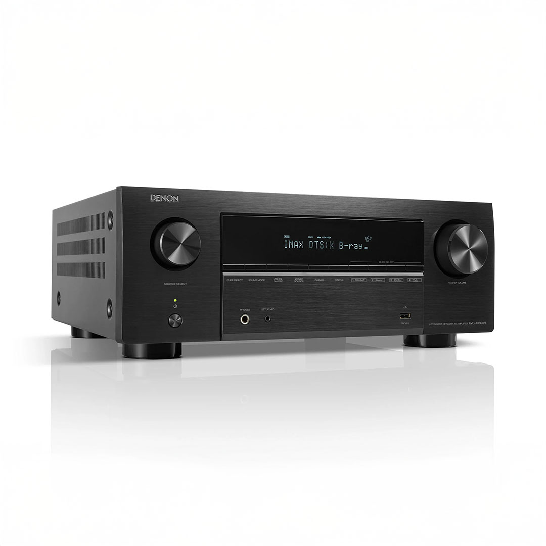 Denon black audio receiver with display and knobs.