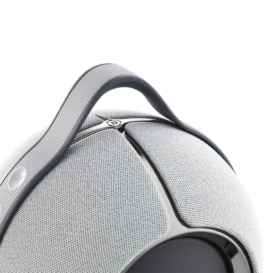 Close-up of spherical gray speaker with handle