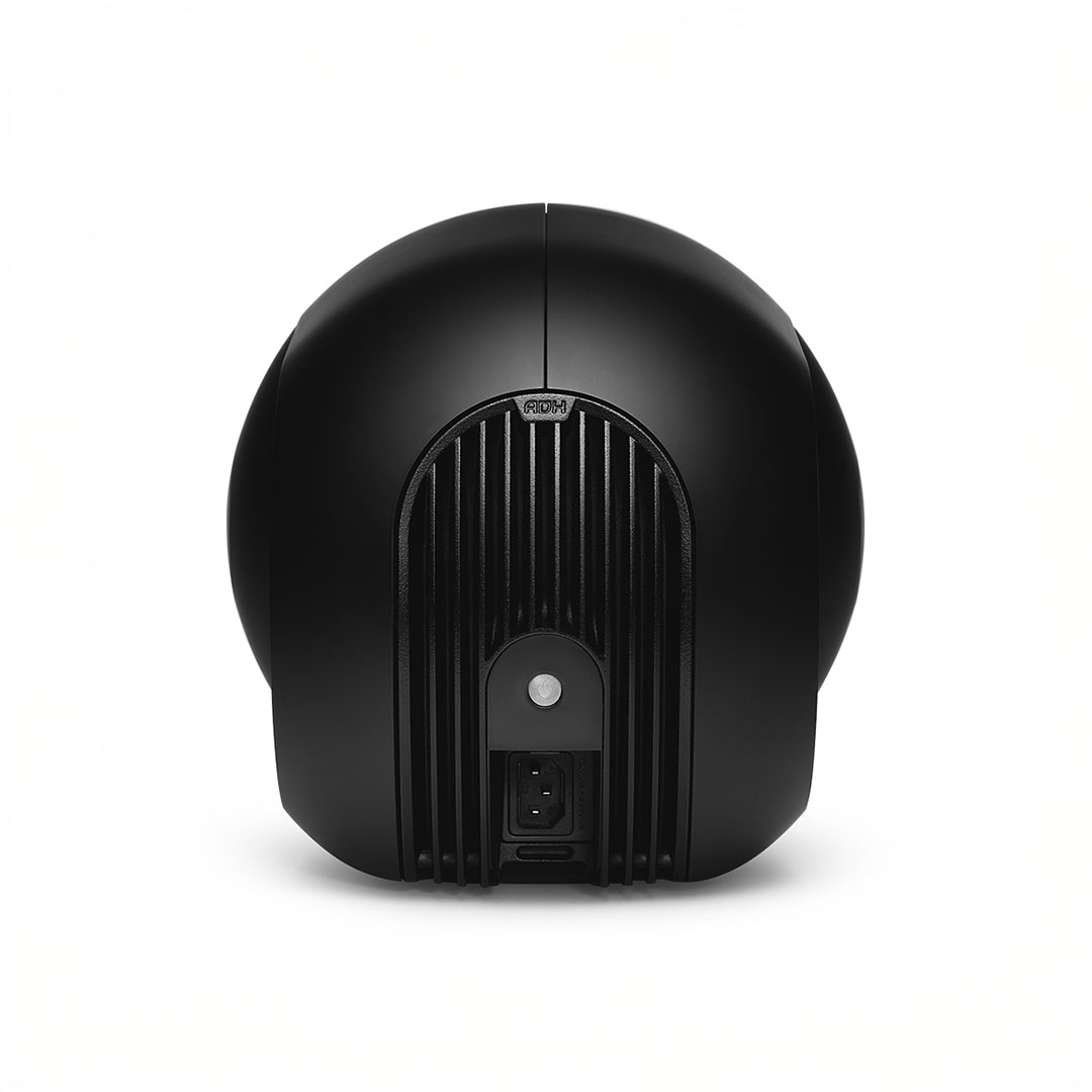 Back view of black round speaker.
