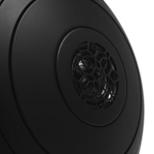Close-up of black circular speaker with grille design.