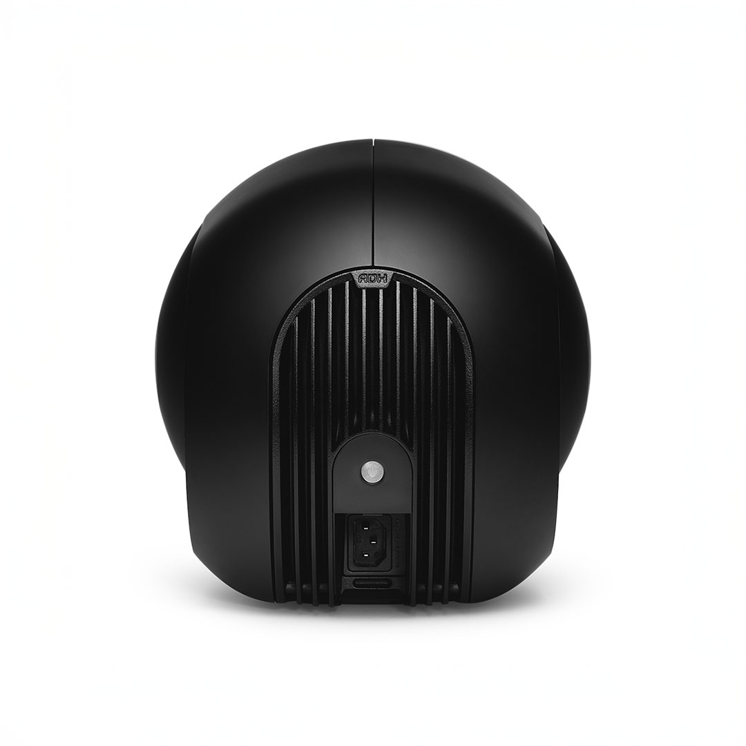 Black modern speaker with ribbed design, rear view.