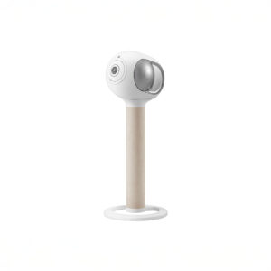 Sleek white speaker on wooden stand