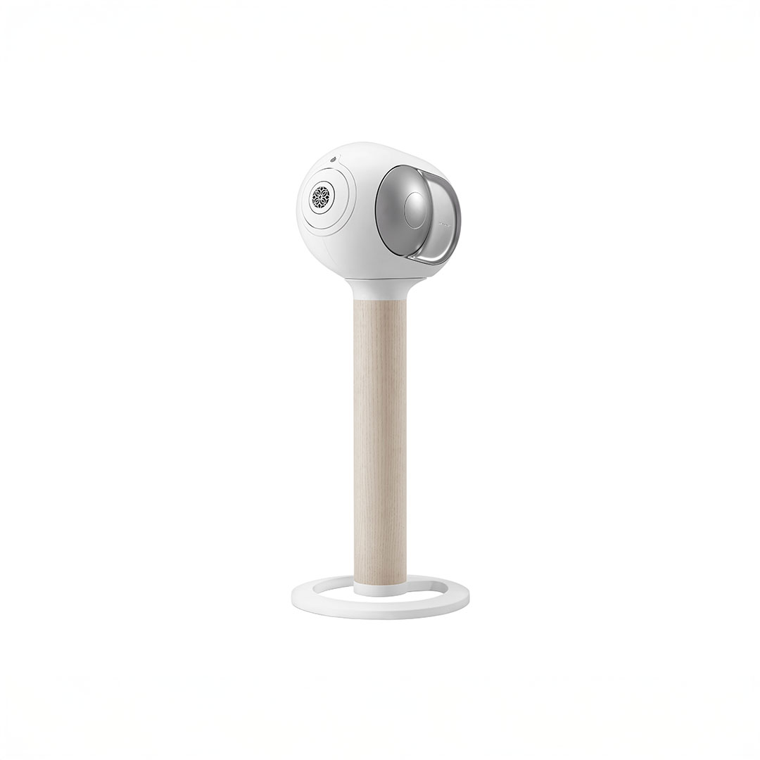 Sleek white speaker on wooden stand