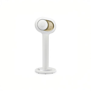 Modern speaker on white stand, minimalistic design.