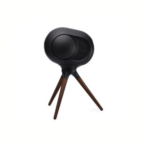 Black modern speaker on wooden tripod stand.