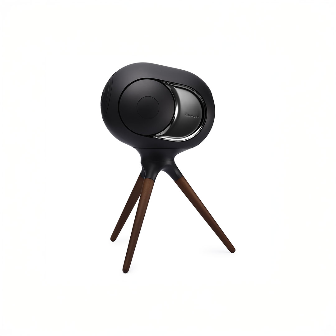 Elegant black speaker on wooden tripod stand.