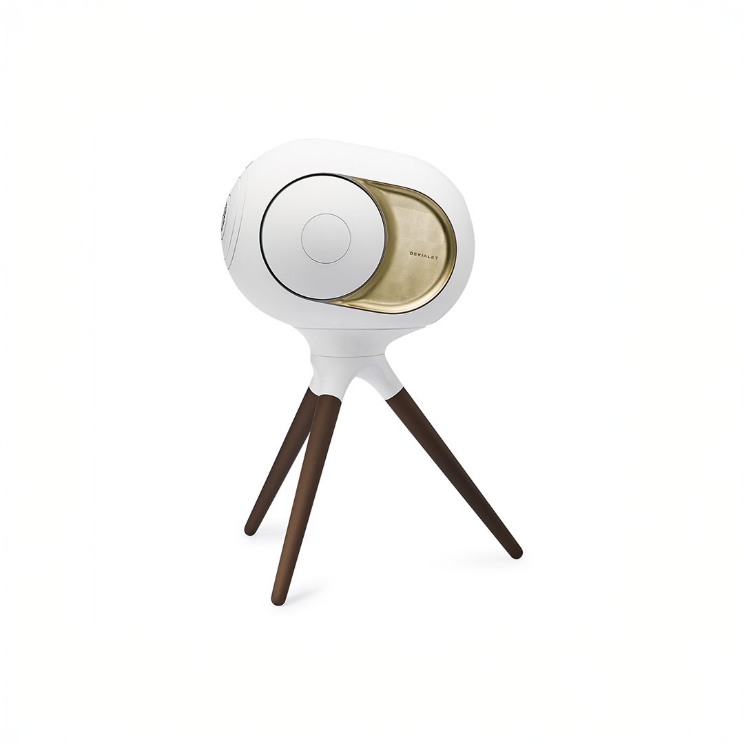 Stylish white speaker with wooden tripod stand.