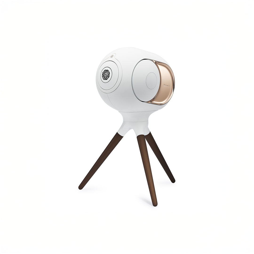 Portable white speaker on tripod stand.