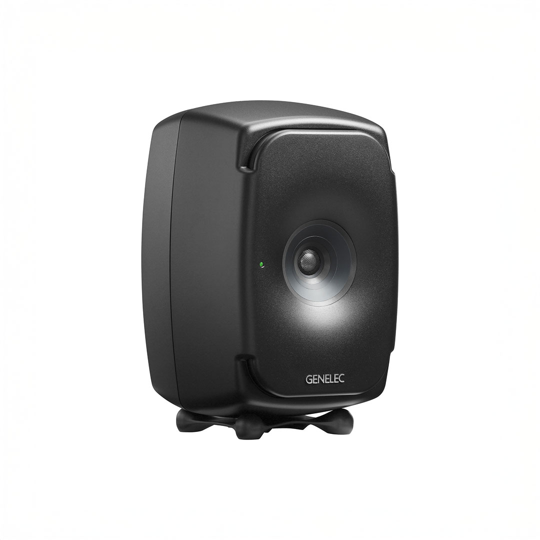 Black Genelec speaker with a glowing LED indicator.