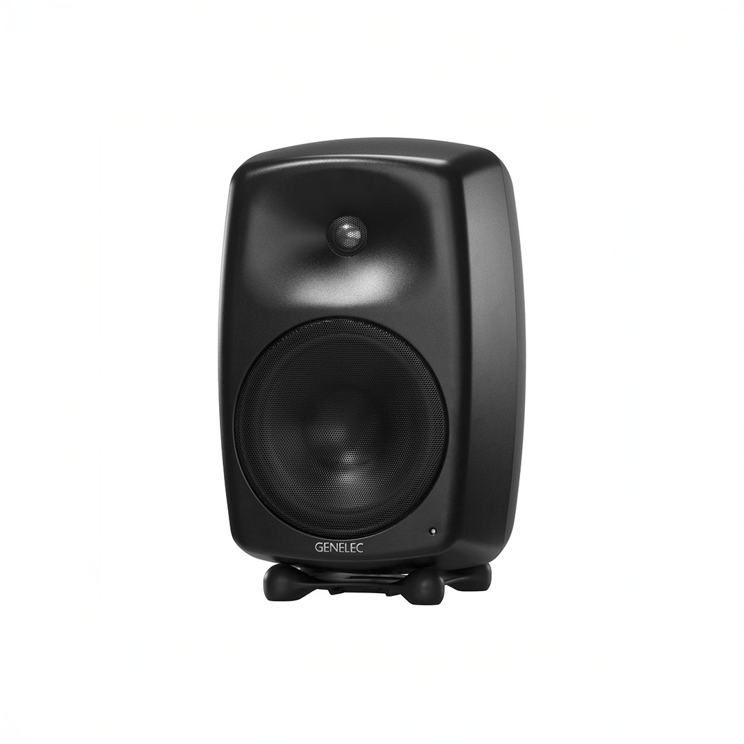 Black studio monitor speaker on white background.