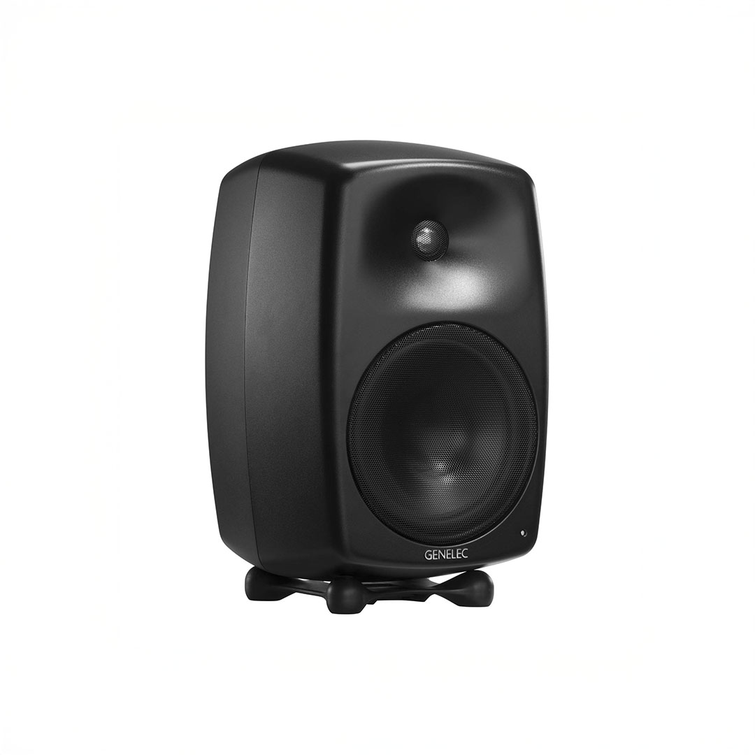 Black studio monitor speaker on white background.