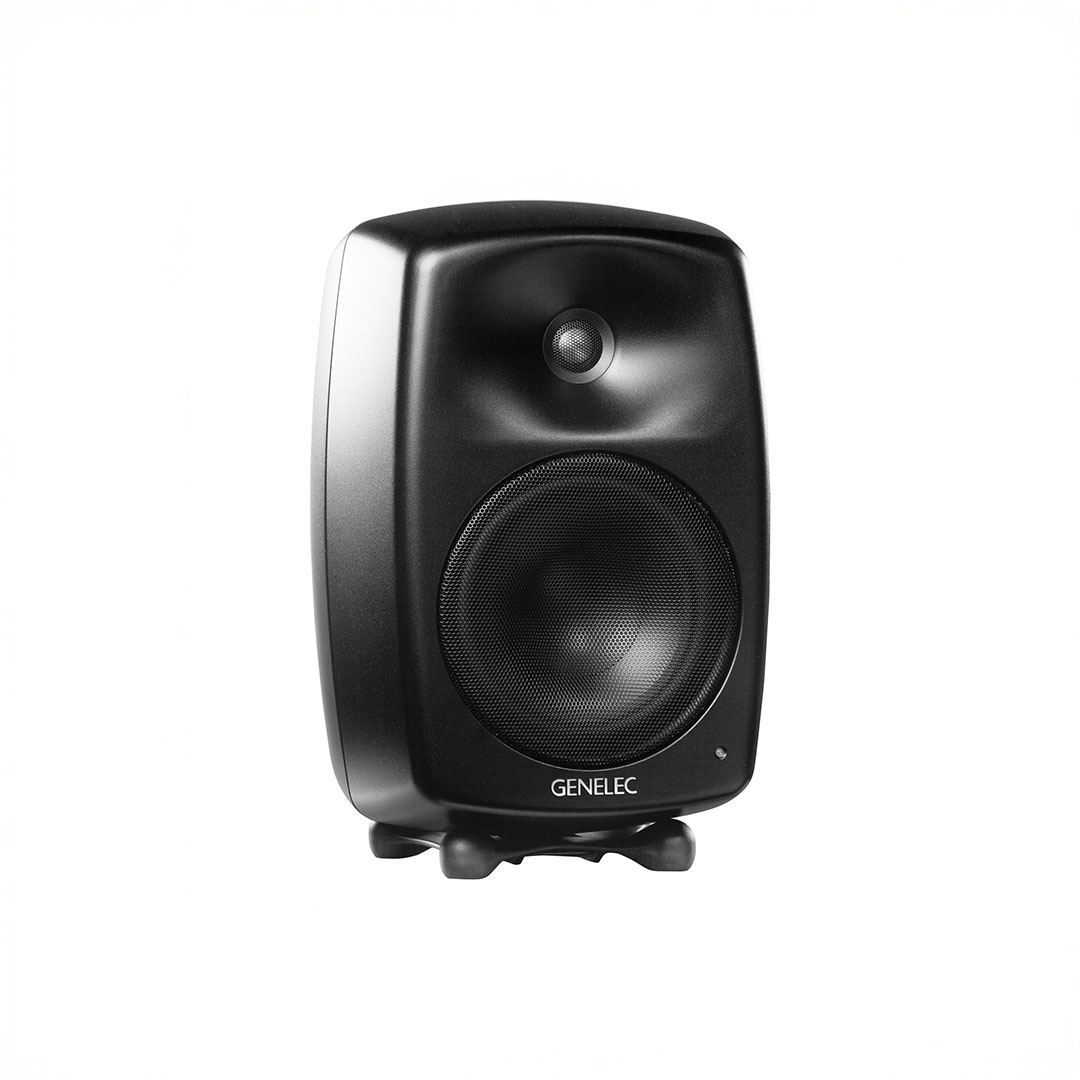 Black Genelec speaker on white background.
