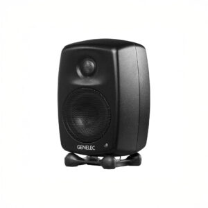 Black studio monitor speaker on white background.