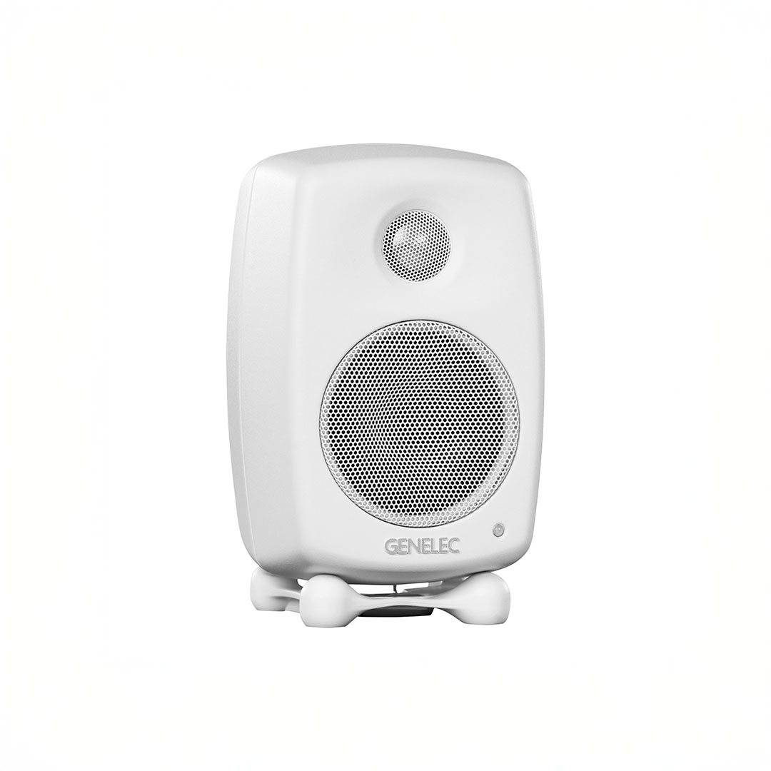 White Genelec speaker on display.