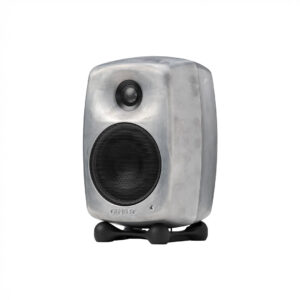 Modern silver audio speaker on stand.