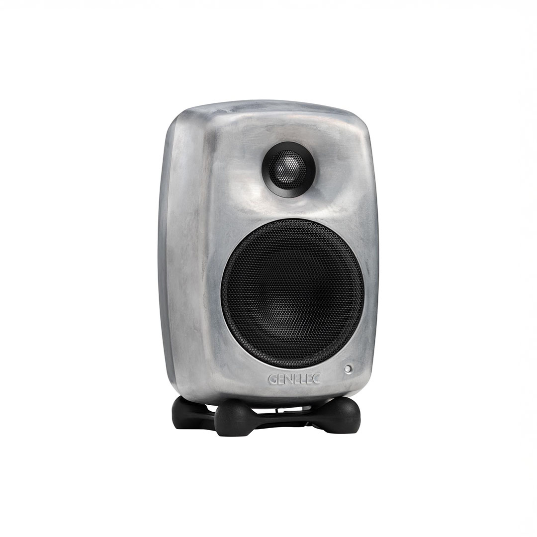 Compact gray speaker with black grille