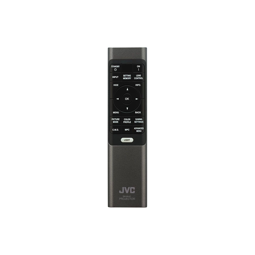 JVC projector remote control on white background.