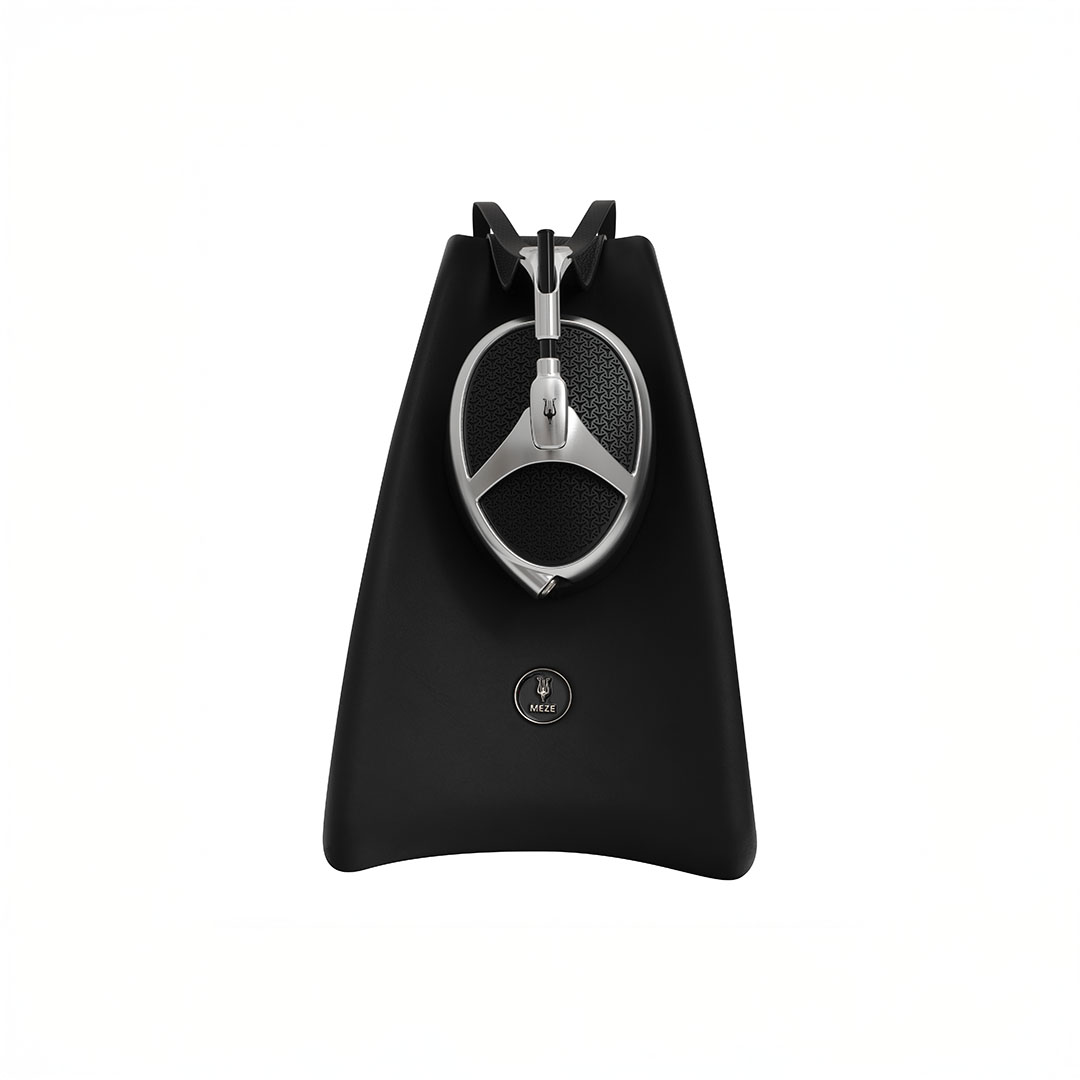 Over-ear headphones on black stand, minimalist design.