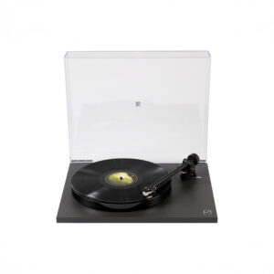 Turntable playing a vinyl record with clear lid.