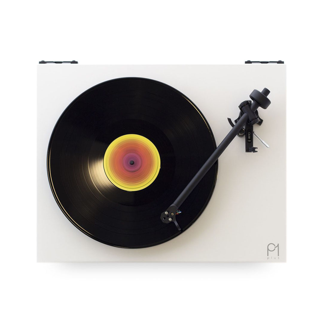 Top view of spinning vinyl record on turntable