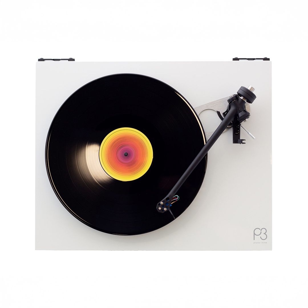 Vinyl record spinning on turntable top view.