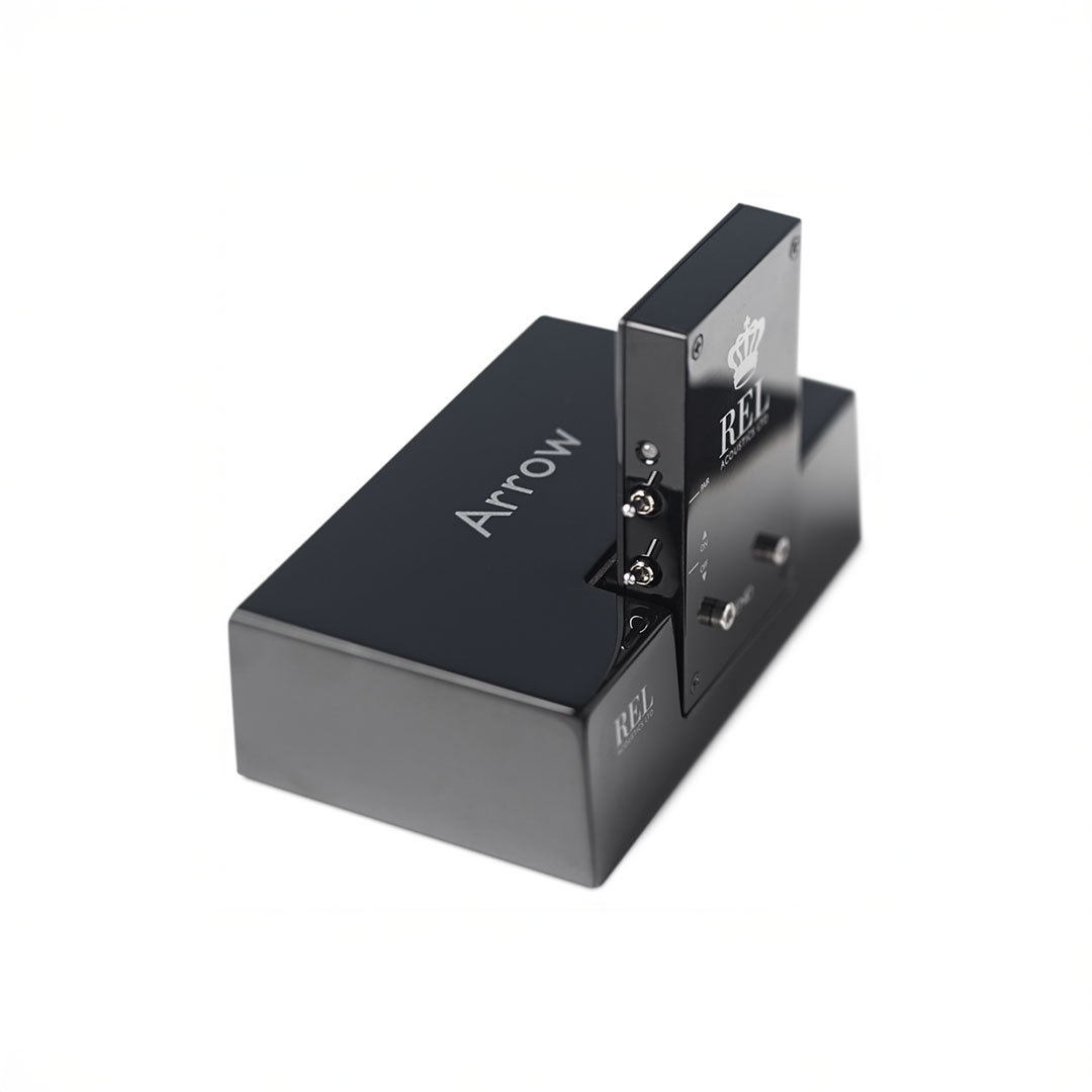Black wireless subwoofer transmitter, Arrow model by REL.