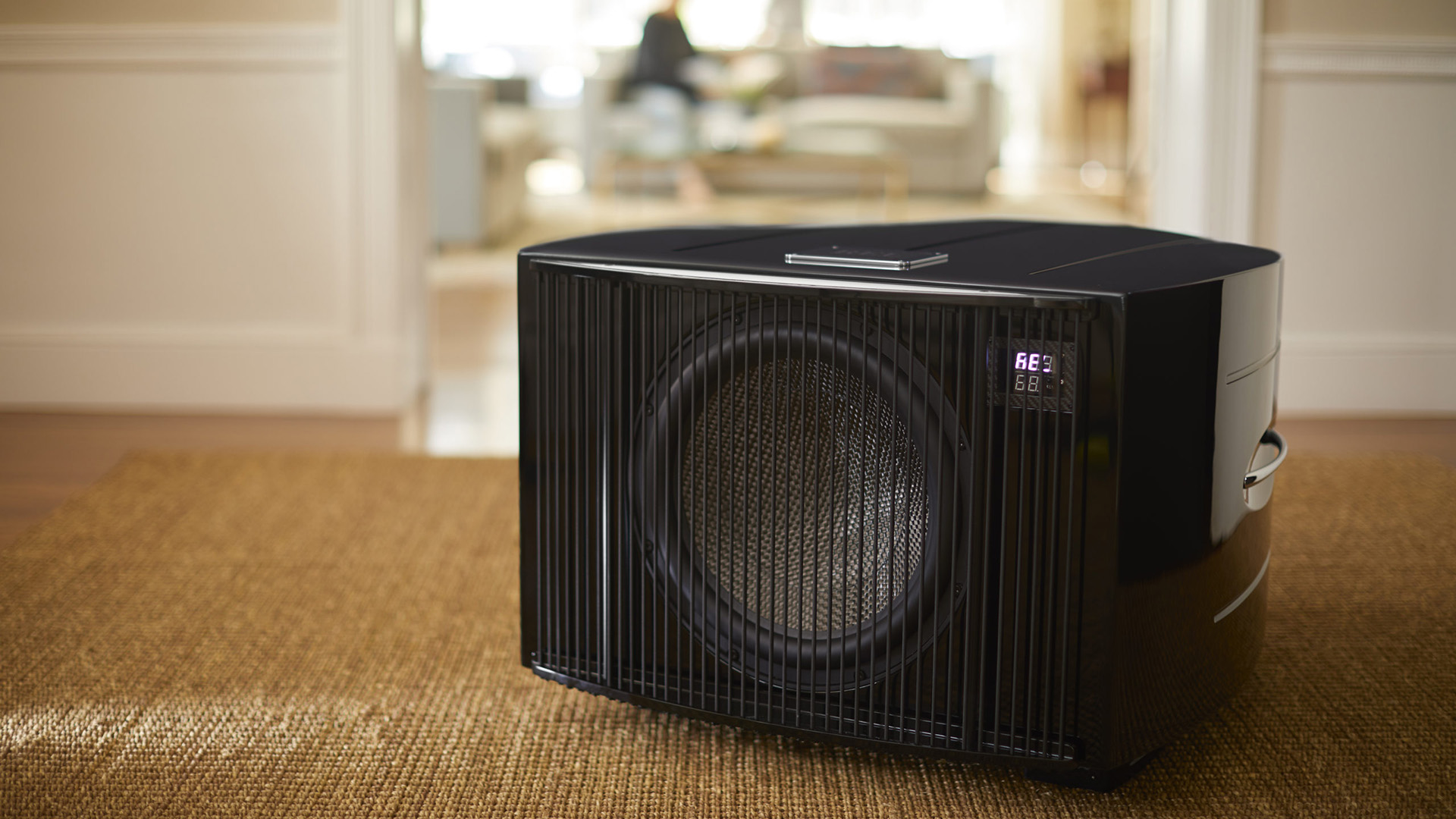 Modern black REL subwoofer in living room