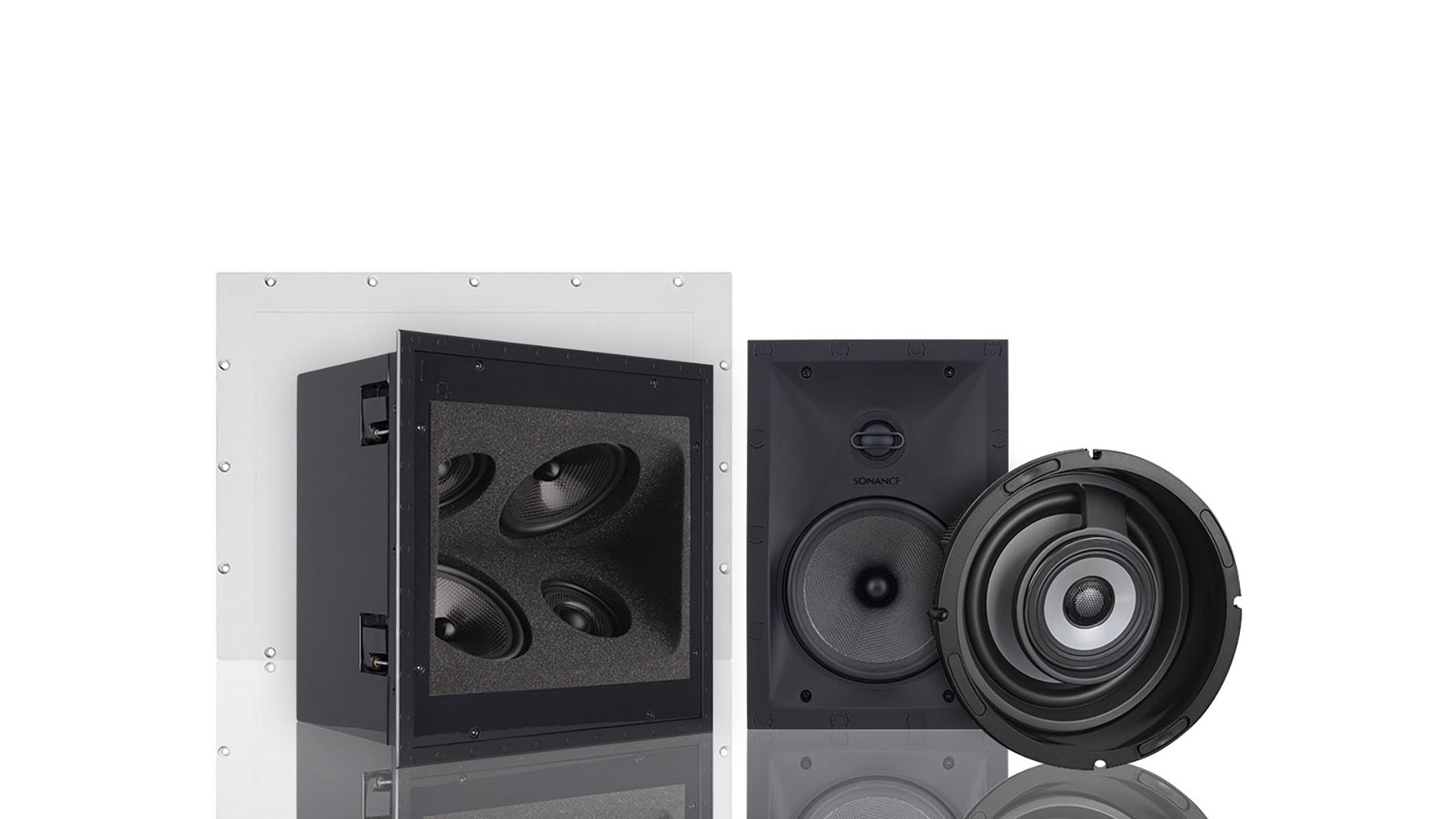 In-wall and ceiling speakers on display in white environment