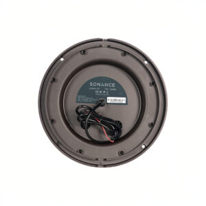 Bottom view of a circular speaker with wires.
