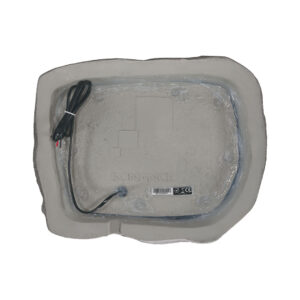 Bottom view of speaker with wire attached.