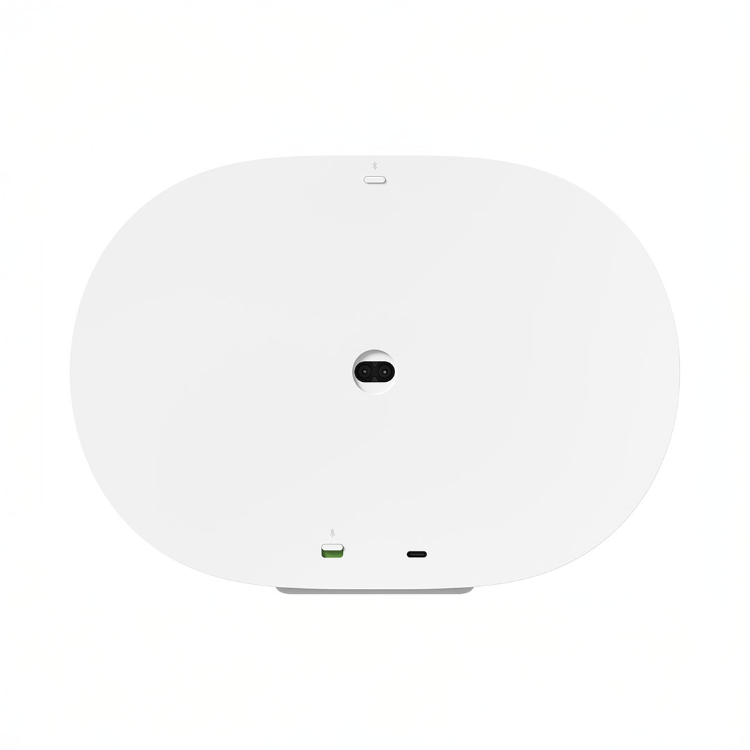 White device with camera and ports, top view.