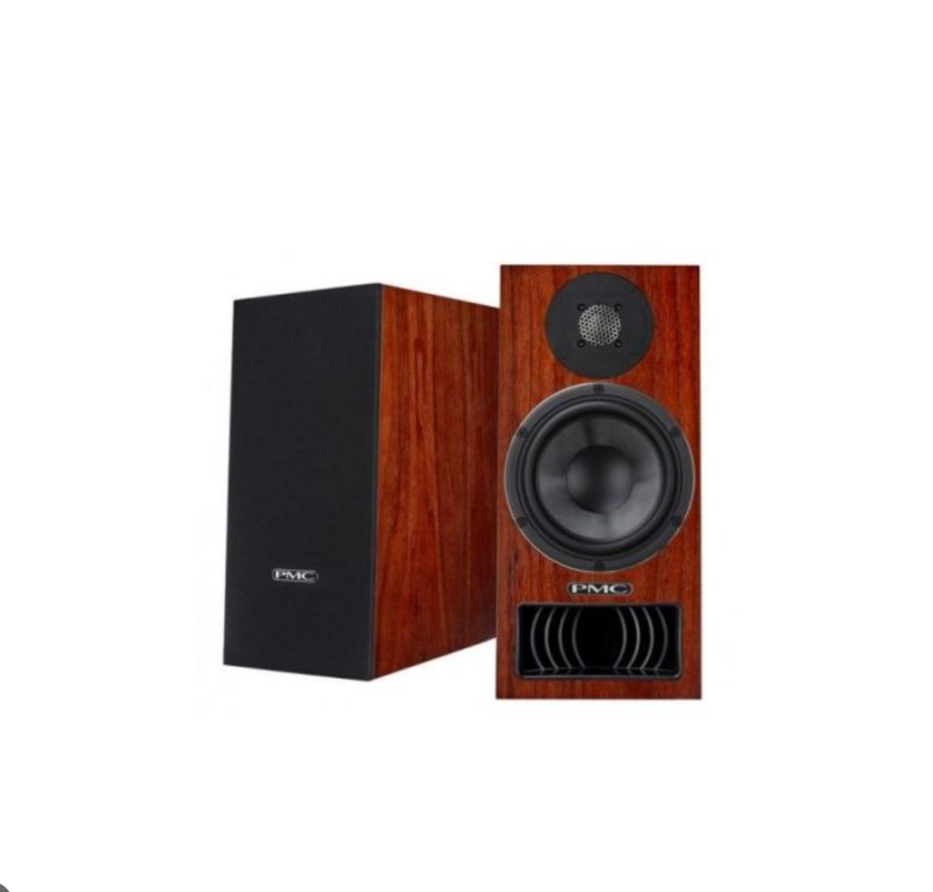 Wooden PMC bookshelf speakers with black grilles.