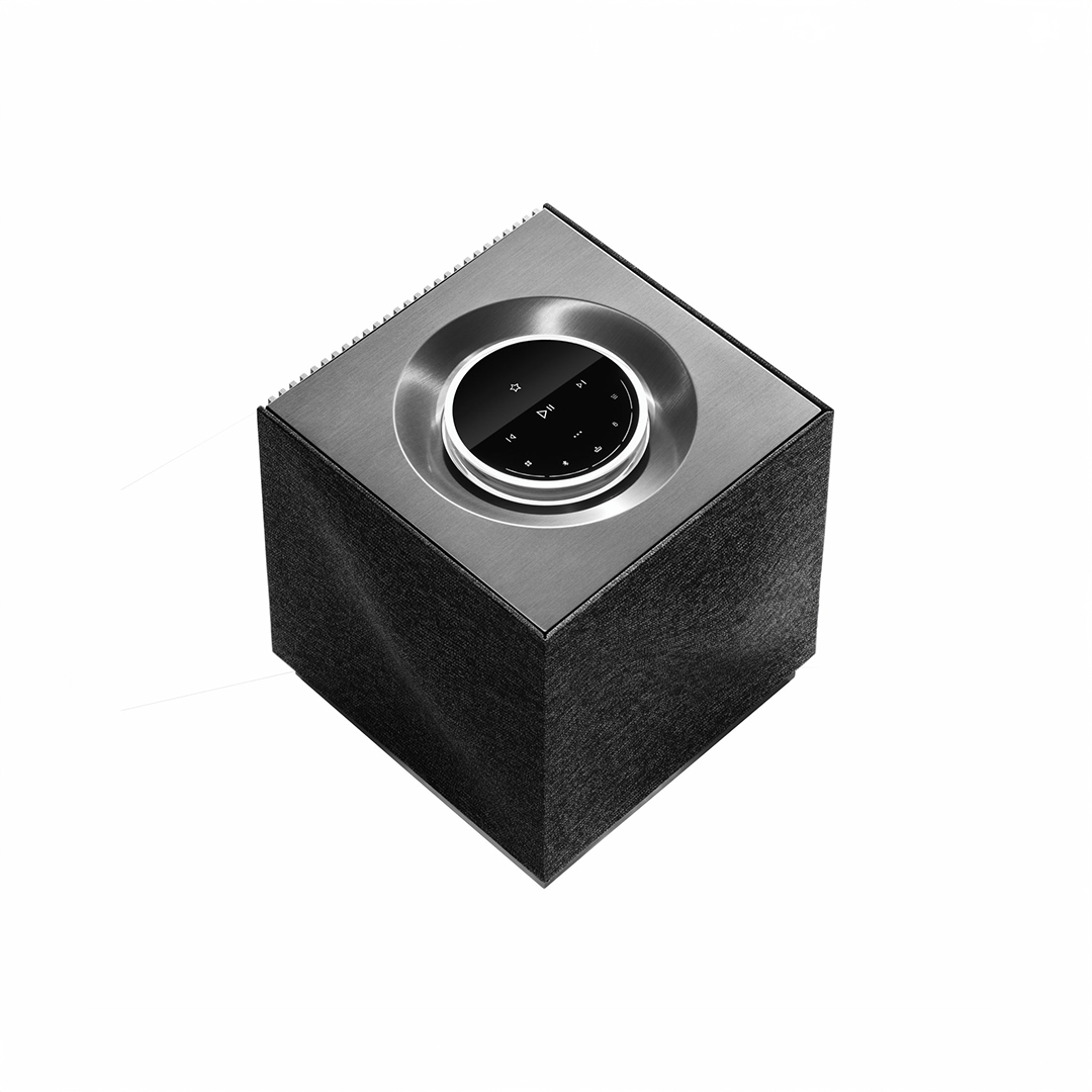 Stylish gray and black wireless speaker on display.