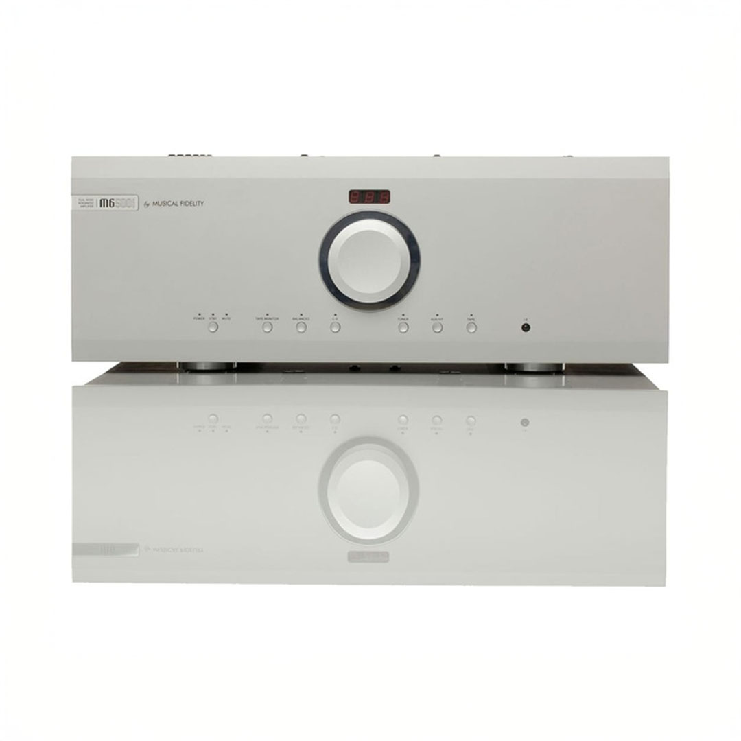 Silver audio amplifier with front control panel.