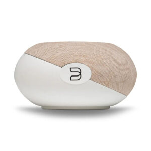 Modern speaker with fabric top, sleek design.