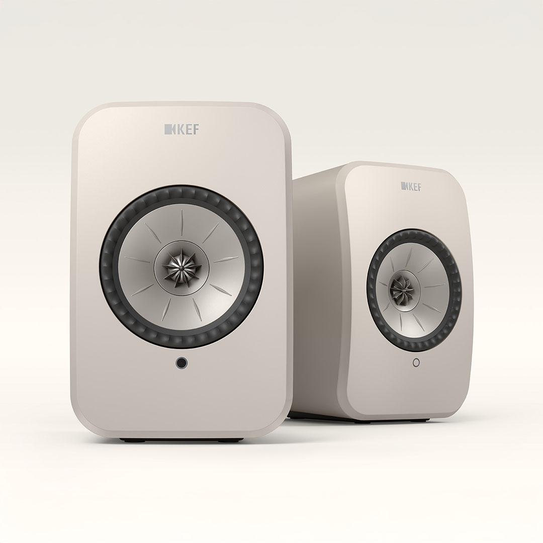 Two modern wireless speakers on white background.