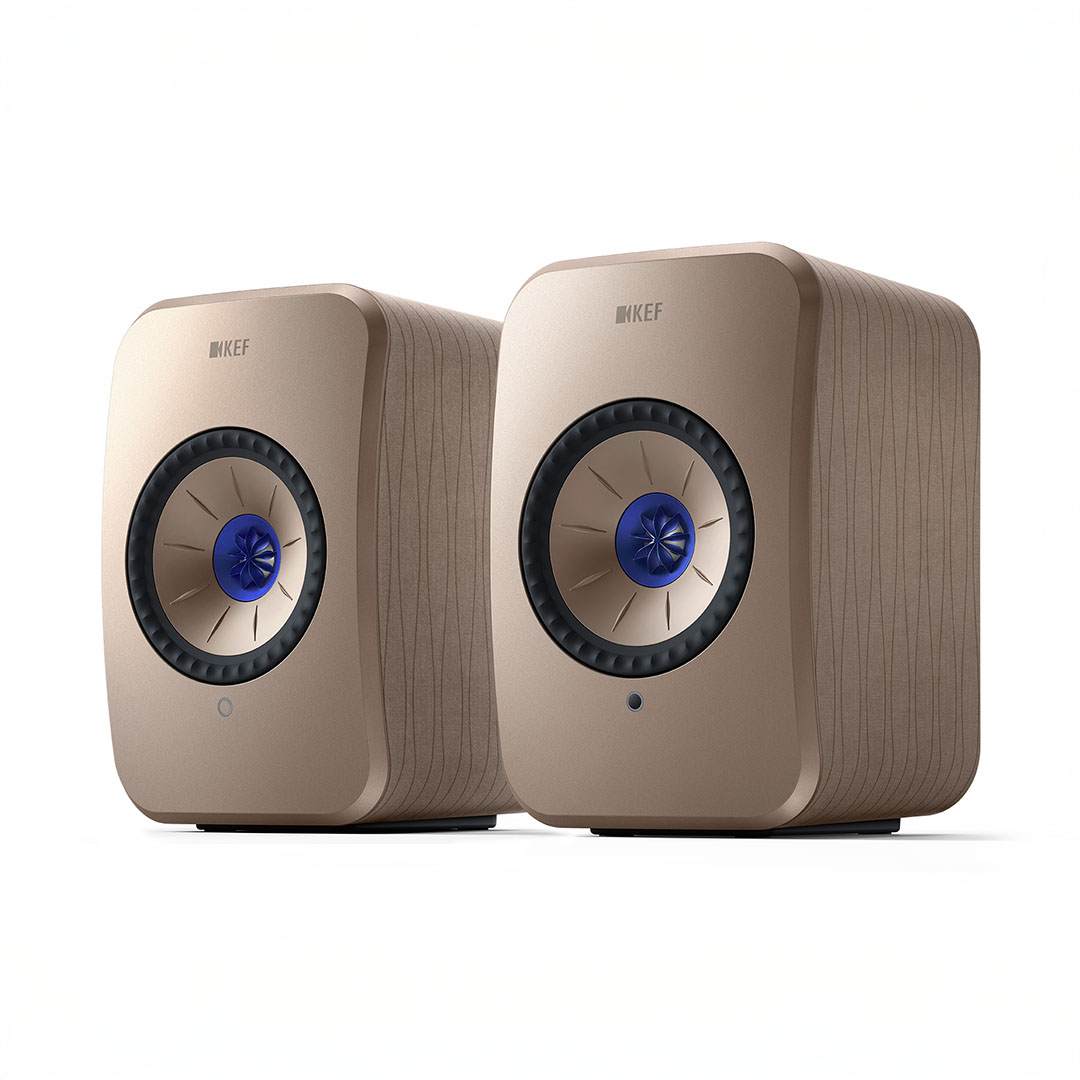 Pair of modern beige speakers with blue accents.