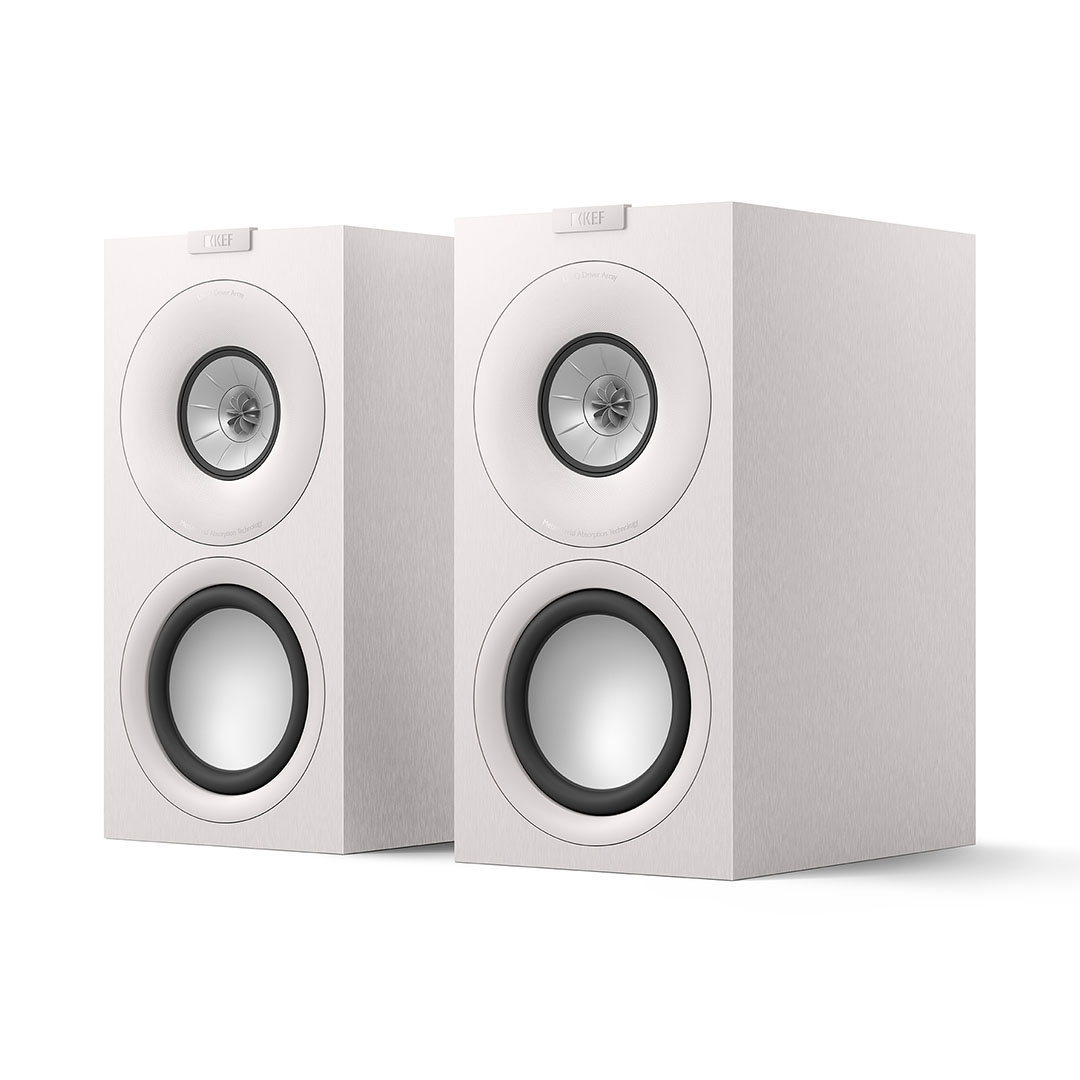 Two white high-quality speakers side by side