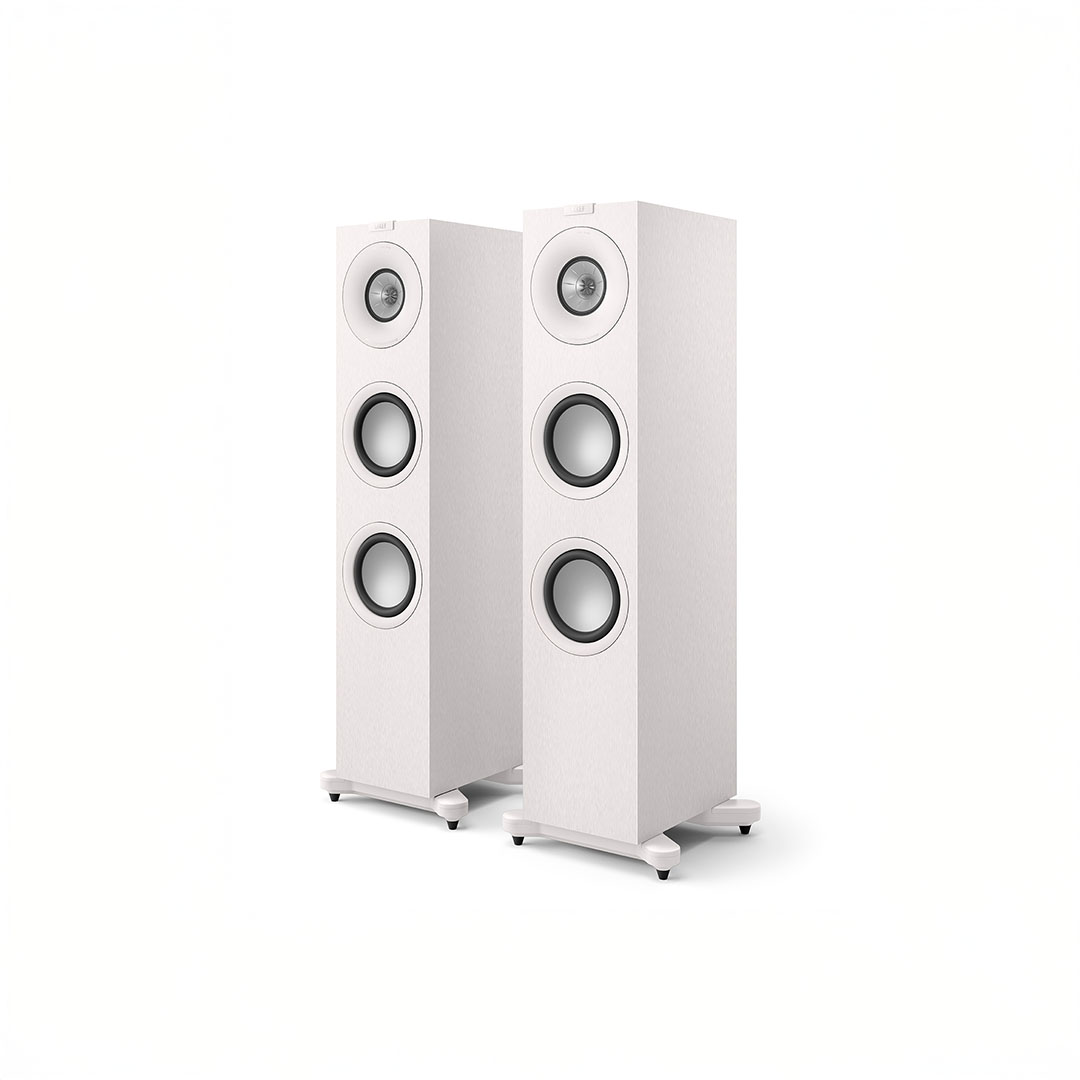 White floor-standing speakers, modern audio equipment