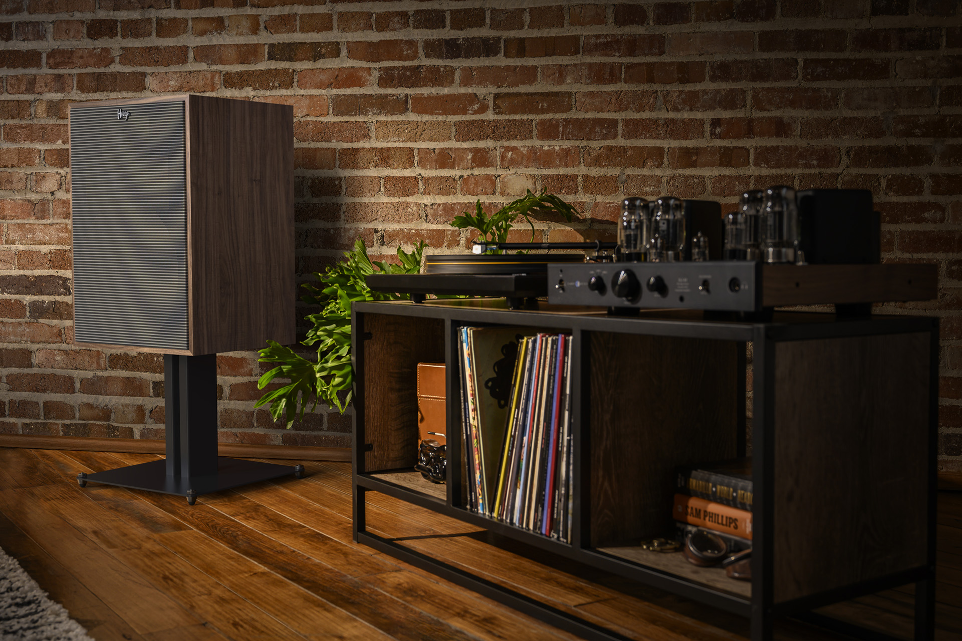 Vintage speaker and turntable with vinyl records.